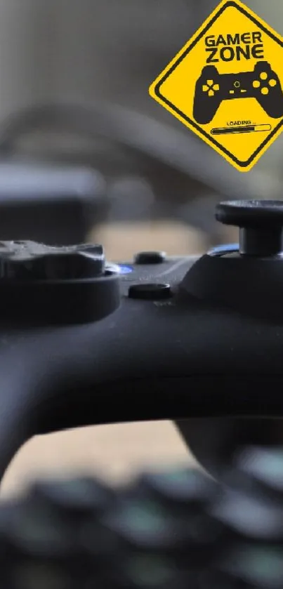 Close-up of gaming controller with Game Zone sign in background.