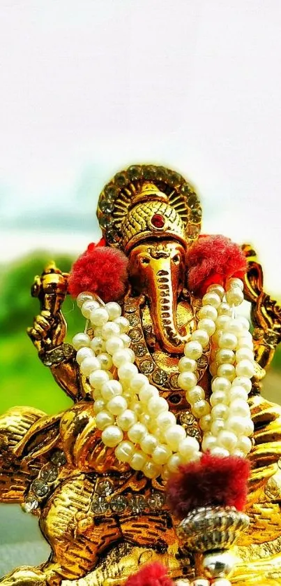 Golden Ganesha statue with vibrant colors