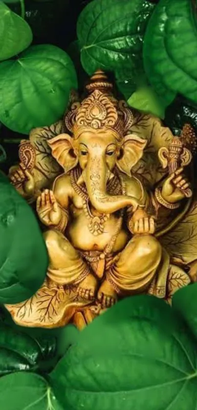 Golden Ganesha statue among green leaves wallpaper.