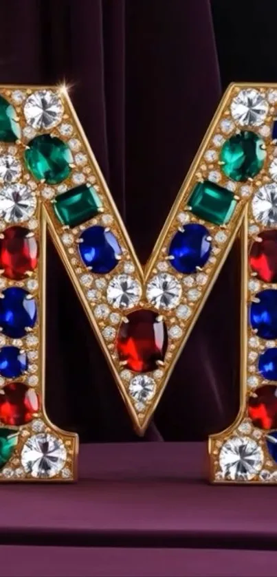 Gem-encrusted letter M with vibrant jewels on display