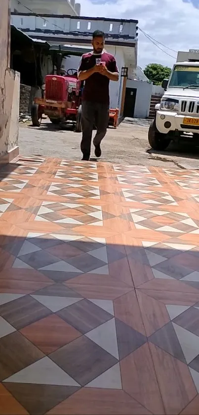 Geometric pattern on a driveway with intricate brown tiles.