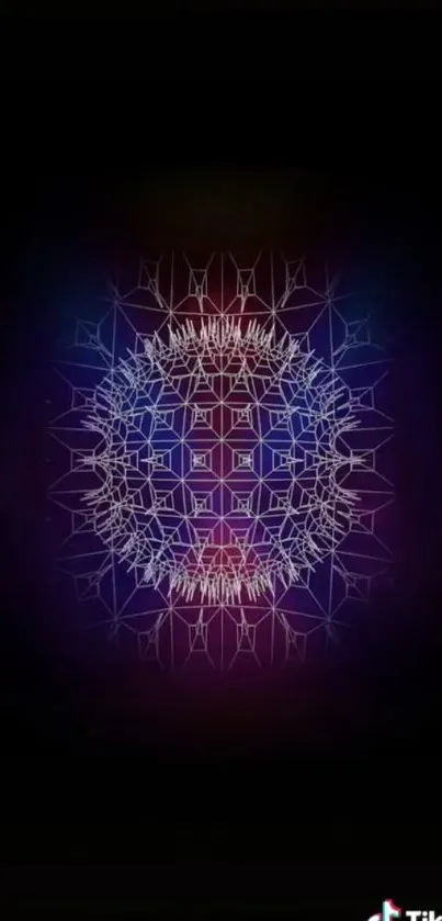 Intricate neon mandala on a dark background wallpaper.