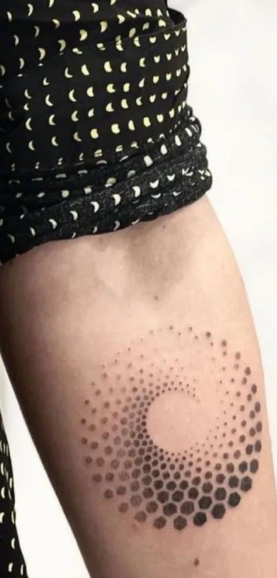 Geometric arm tattoo with circular dots pattern.