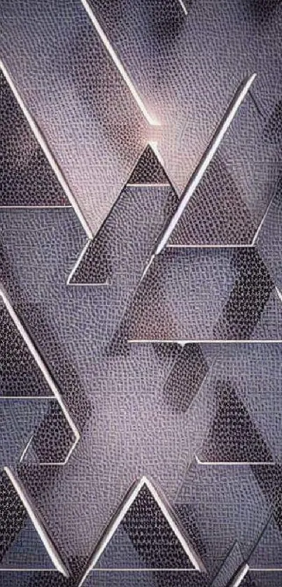 Geometric triangle pattern on a textured gray background.