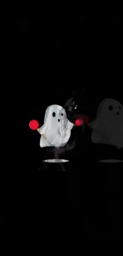 Cute ghost figures with red accents on a black wallpaper.