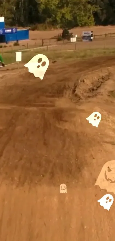 Dirt bike on rugged track with animated ghosts floating.