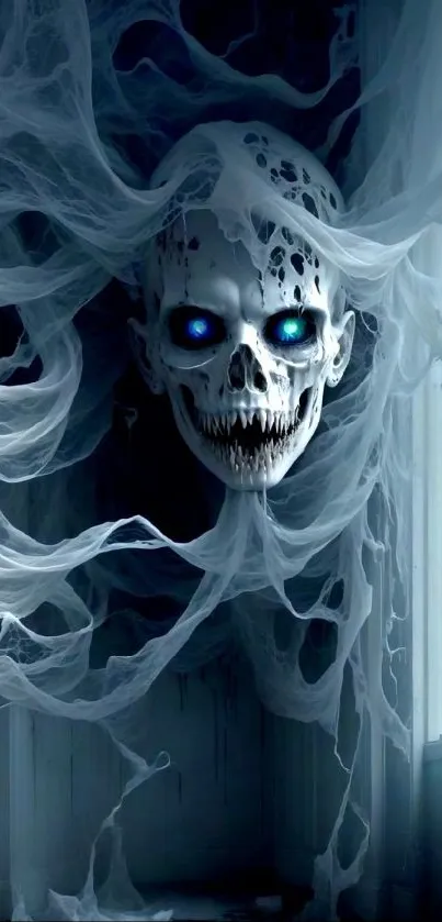 Ghostly skull with glowing blue eyes in swirling mist wallpaper.