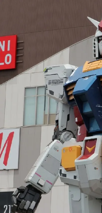 Giant robot statue in urban setting with store signs.