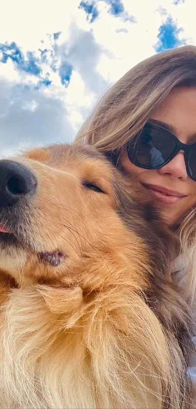 Girl and fluffy dog enjoying a sunny day with blue sky.