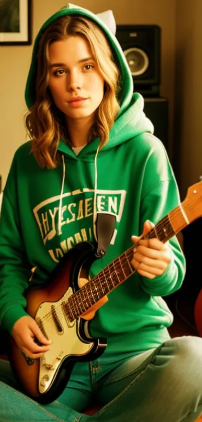 Girl in green hoodie playing guitar in a cozy room.