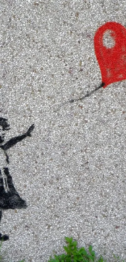 Street art of a girl reaching for a heart-shaped balloon on a concrete wall.