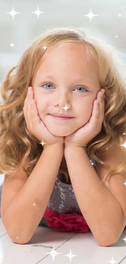 Blonde girl smiling on a bright white floor, surrounded by natural light.