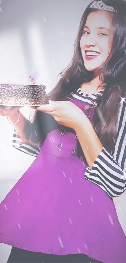 Joyful girl holding cake in purple dress.