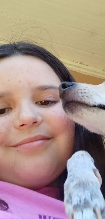 Smiling girl with her dog in a close-up shot.