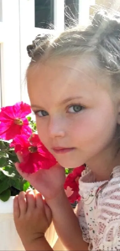 Young girl with pink flowers in bright sunlight, perfect for wallpapers.