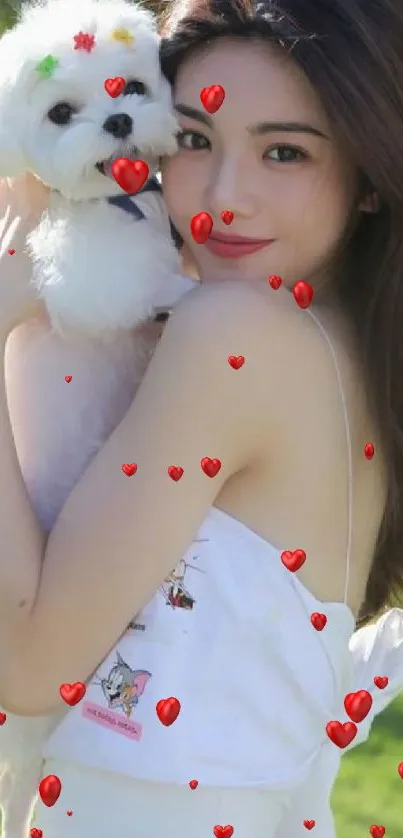 Girl holds fluffy white dog in a sunny outdoor setting, capturing a joyful moment.