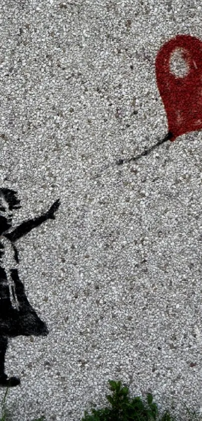 Artistic wall image of a girl reaching for a red balloon.