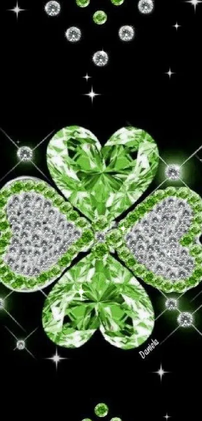 Green clover with diamonds on black background.