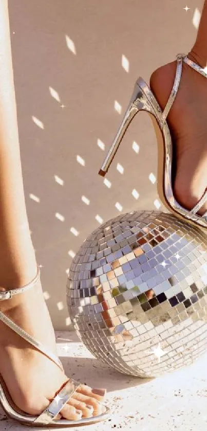 High heels with disco ball reflecting light on beige background.