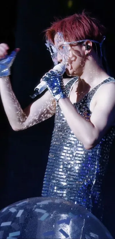 Glamorous performer in sparkling outfit on stage.