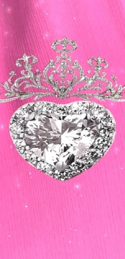 Heart-shaped diamond with crown on pink background wallpaper.