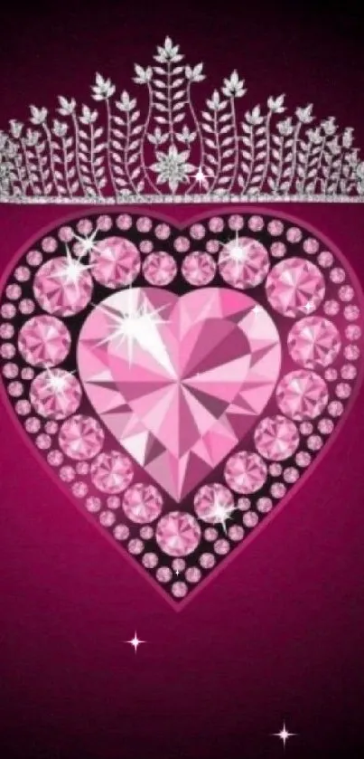 Pink heart wallpaper with a crown and sparkling jewels on dark background.