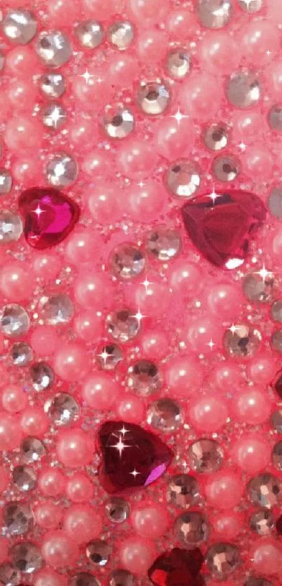 Glamorous pink wallpaper with jewels and pearls.