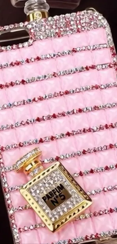 Pink jeweled phone case with perfume charm.