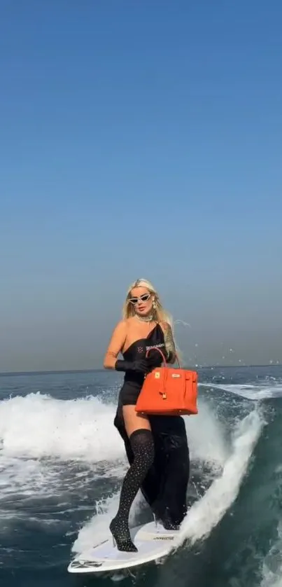 Woman surfing with an orange handbag in blue ocean.