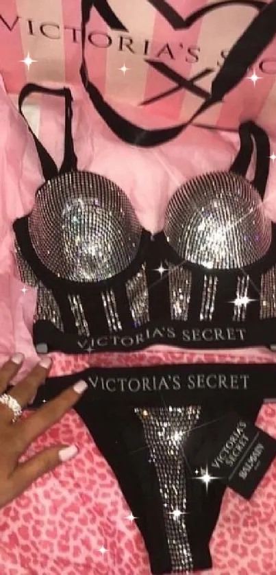 Victoria's Secret lingerie set with pink accessories and bag.