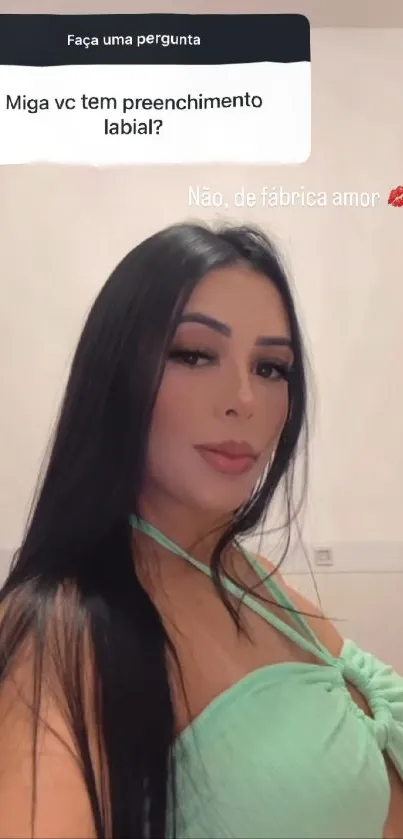 Woman with black hair wearing a green dress.