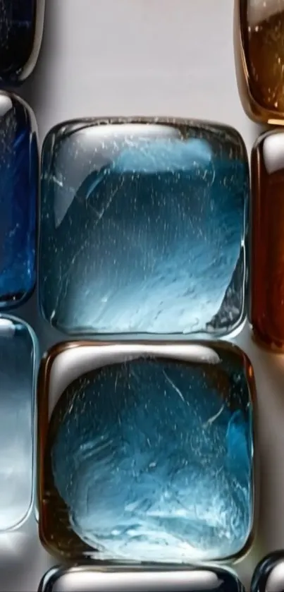 Abstract glass tiles in blue and amber tones.