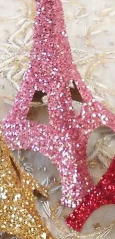 Glitter Eiffel Tower decorations in pink, gold, and red.