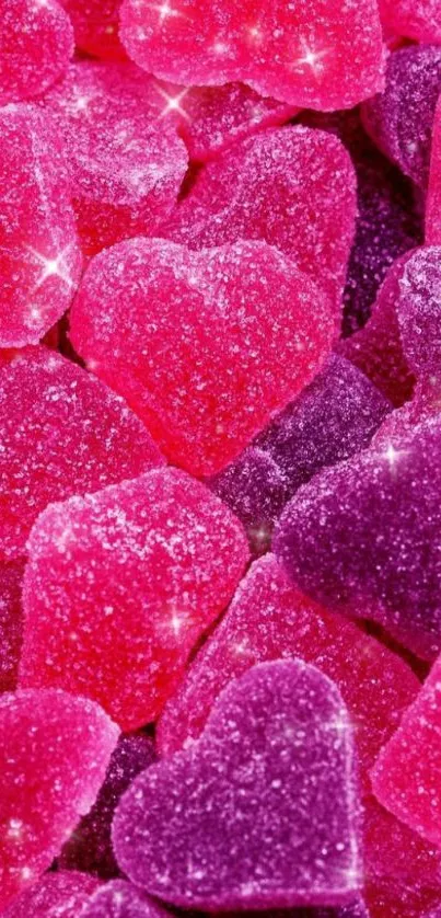 Sparkly pink and purple heart candy wallpaper for mobile devices.