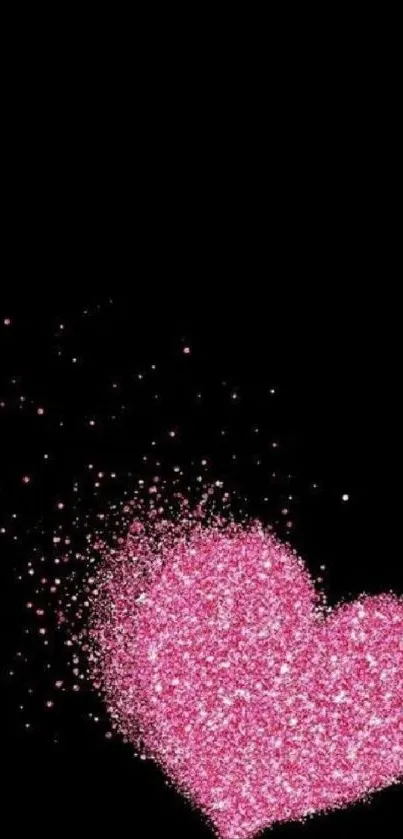 Pink glitter heart on black background wallpaper.