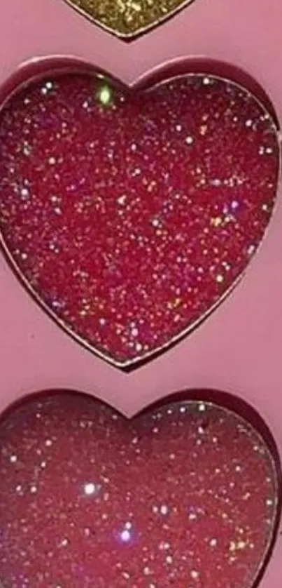 Pink glitter heart wallpaper with sparkle effect.