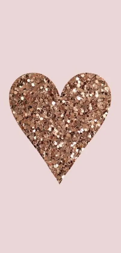 Rose gold glitter heart on light pink background wallpaper.