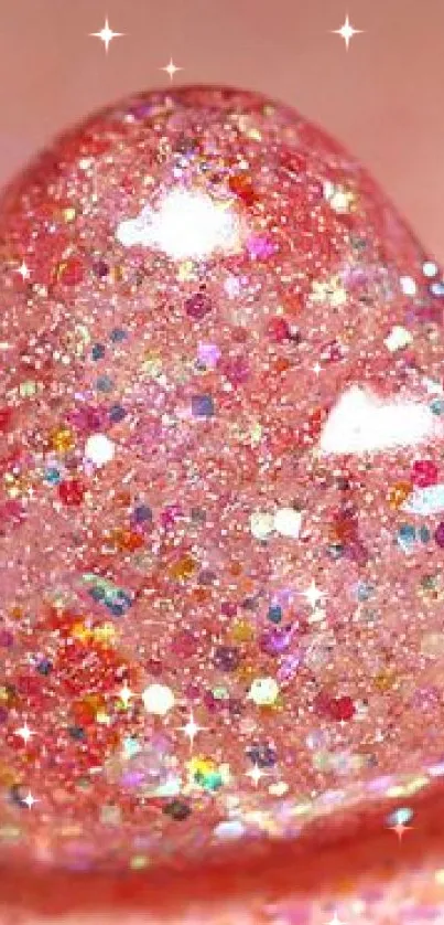 Glittery pink heart on a pink background, sparkling beautifully.