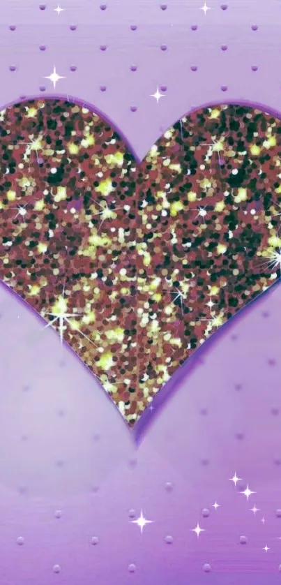 Glitter heart on a purple background with sparkles.