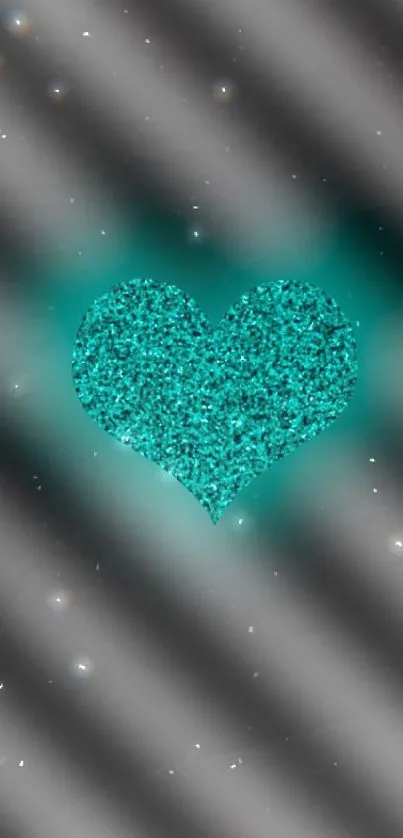 Teal glitter heart on black gradient background.