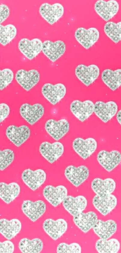 Sparkling glitter hearts on pink wallpaper background.