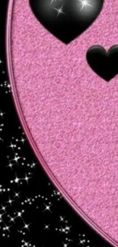 Glittery pink wallpaper with black hearts.