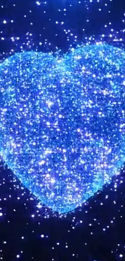 A glittering blue heart with cosmic sparkles on a dark background.