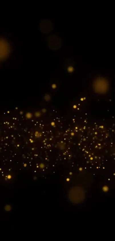 Golden bokeh on black background wallpaper.