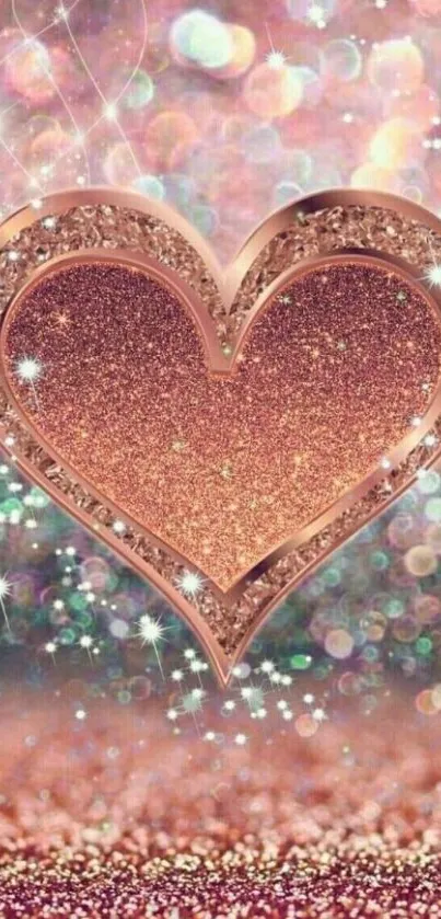 Rose gold glitter heart with sparkling bokeh background on wallpaper.