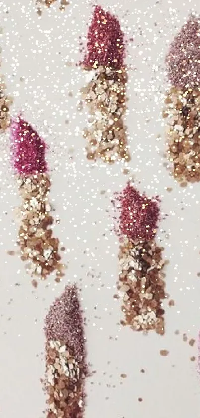 Pink and gold glitter lipstick pattern on off-white background.