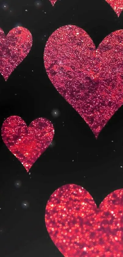 Sparkling red hearts on black background wallpaper.