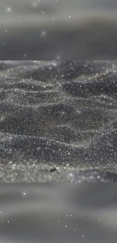 Gray glittering sand texture, perfect for mobile wallpaper.