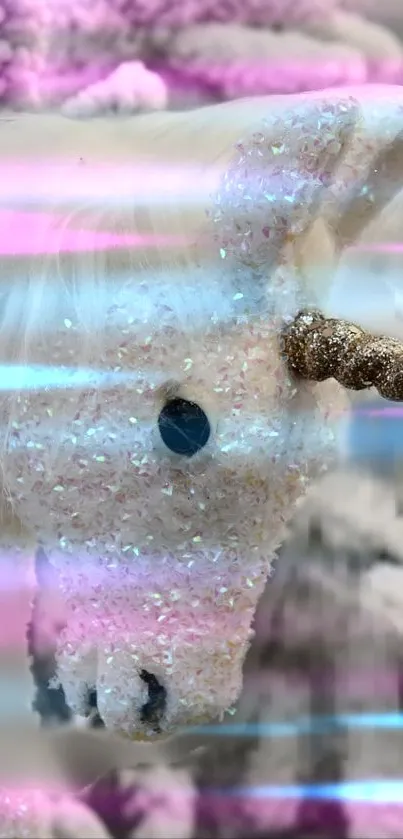 A sparkling pink unicorn with a glittery horn against a dreamy background.