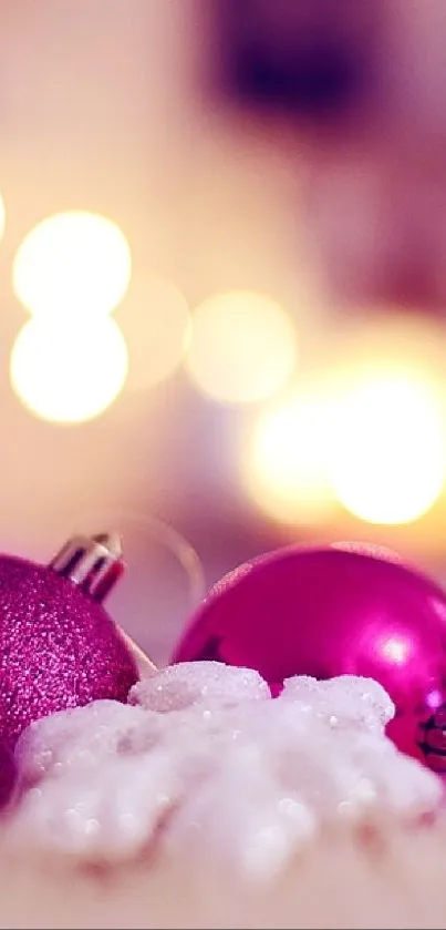 Festive pink ornaments with bokeh lights